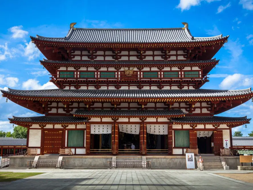 Traditional Japanese architecture with modern Tokyo skyline